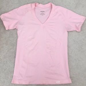 Pink short sleeve workout top.